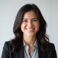 Professional headshot of Dr. Elena Rodriguez, a business trainer.