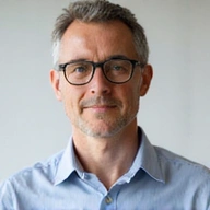 Professional headshot of Dr. Marcus Thorne, a business trainer.